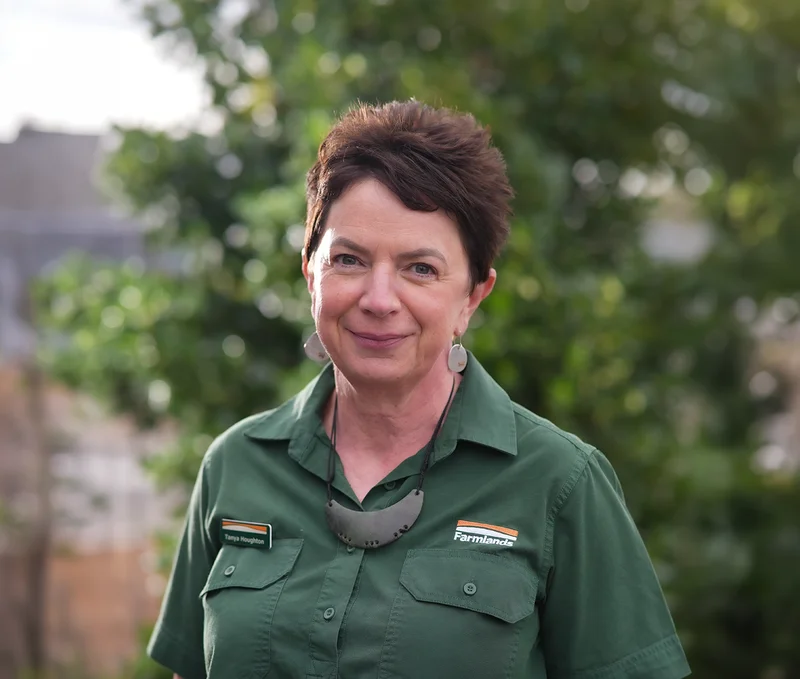 photo of the CEO of Farmlands Co-operative, Tanya Houghton in a green branded button up shirt