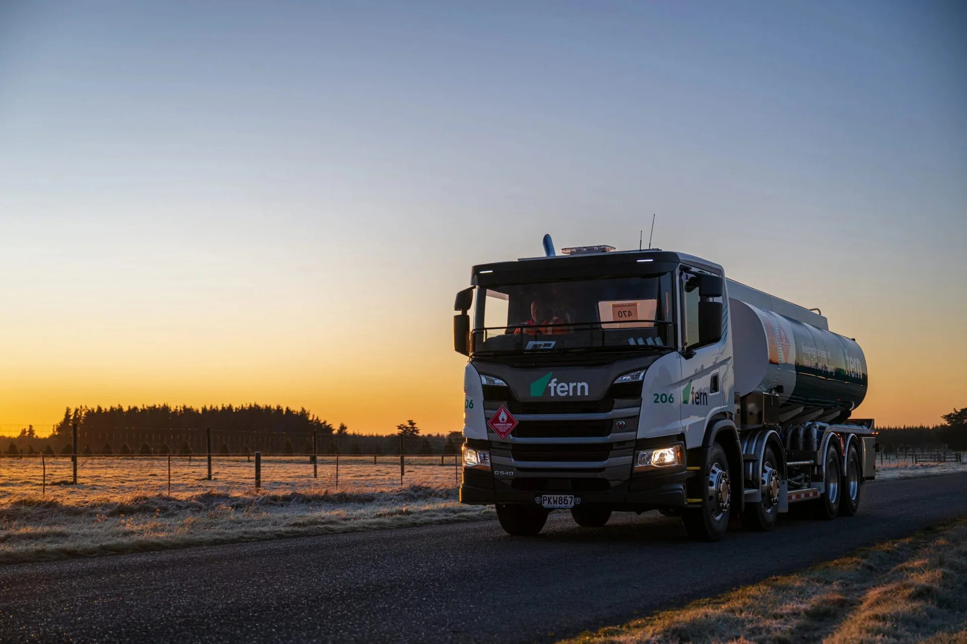 Fern fuel tanker on a rural road at sunrise