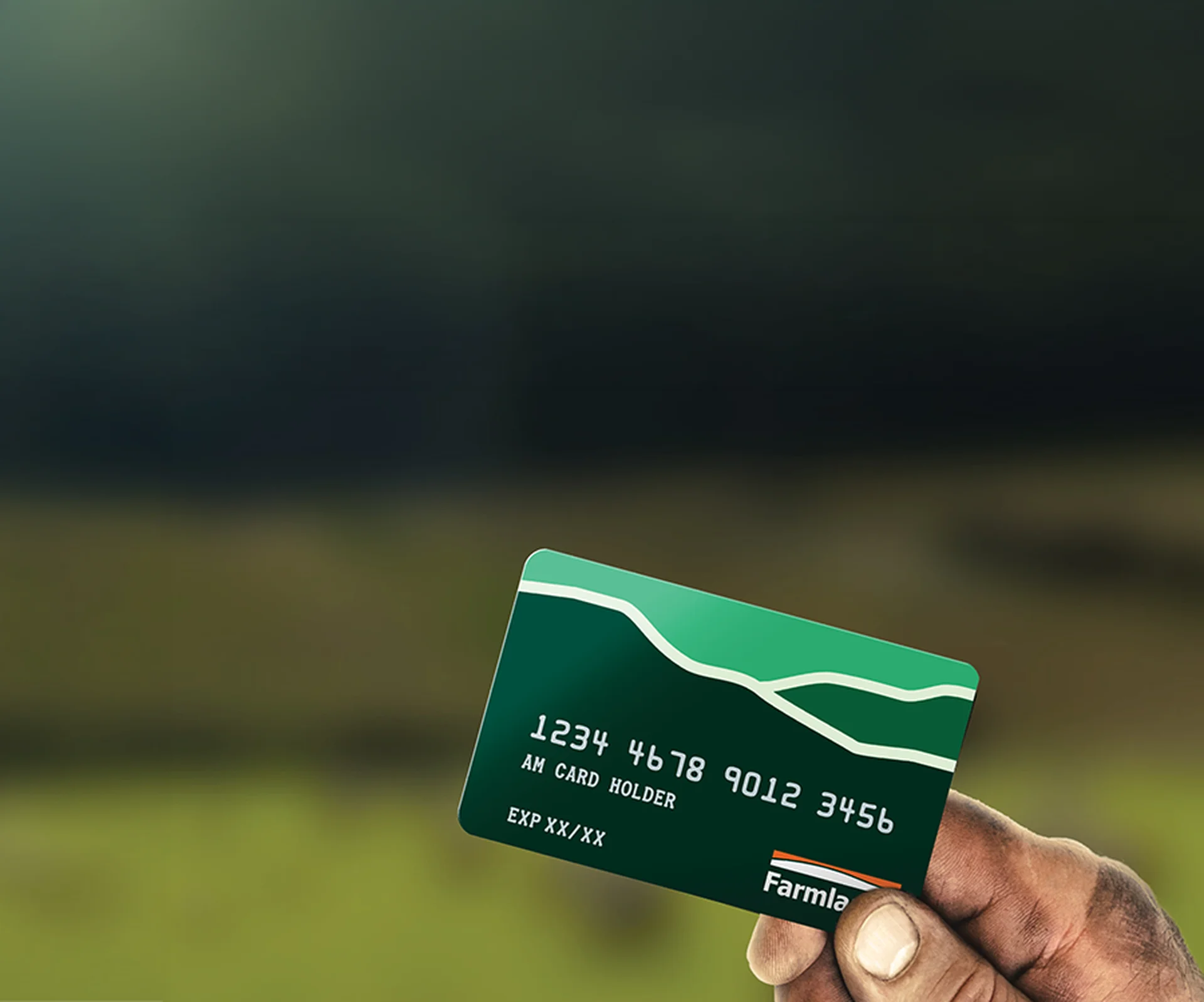 Farmlands card partner: Hand holding a green credit card with white numbers and a 'Farmla' logo against a blurred countryside background.
